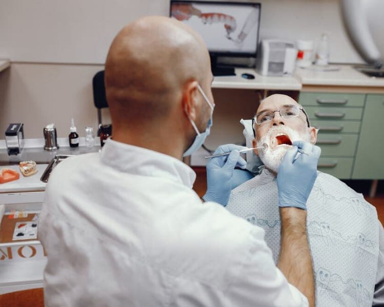 Dentist checking teeth for early decay
