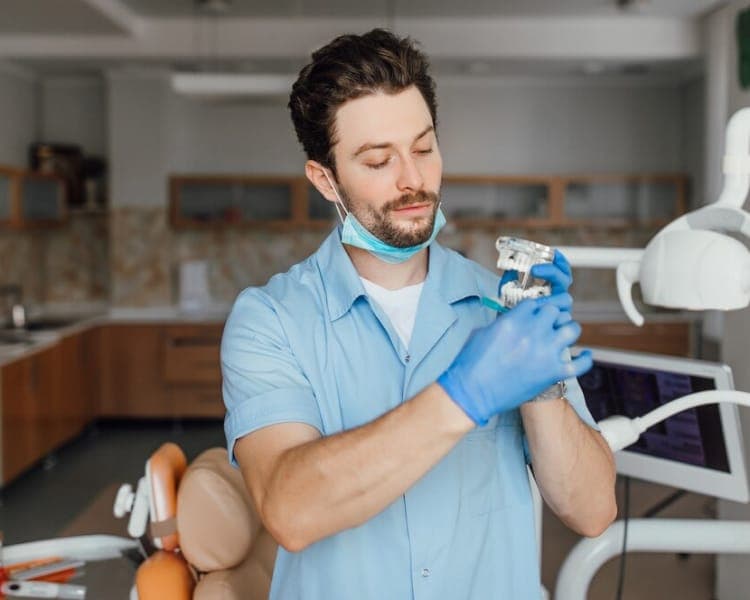 Porcelain dental crown on a model tooth