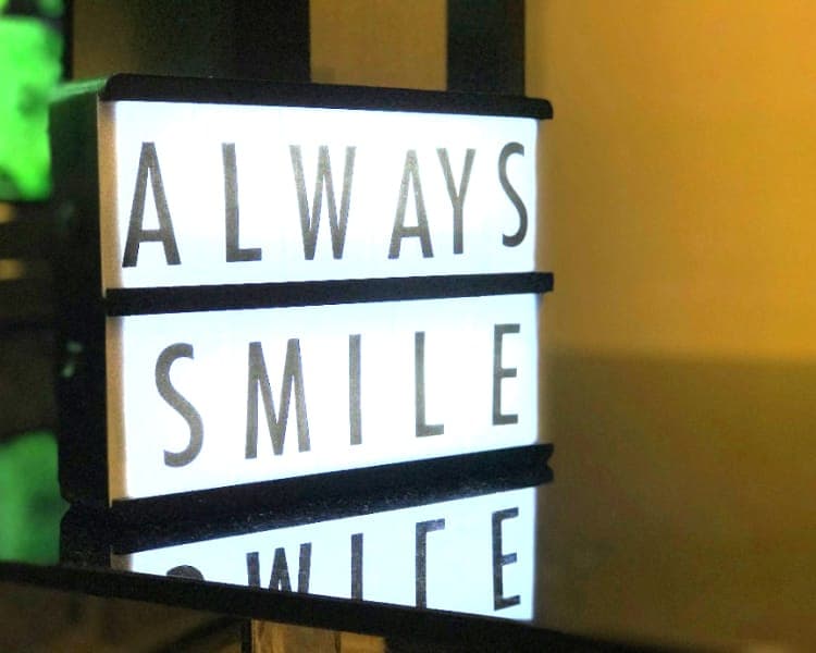Light box sign that reads Always Smile